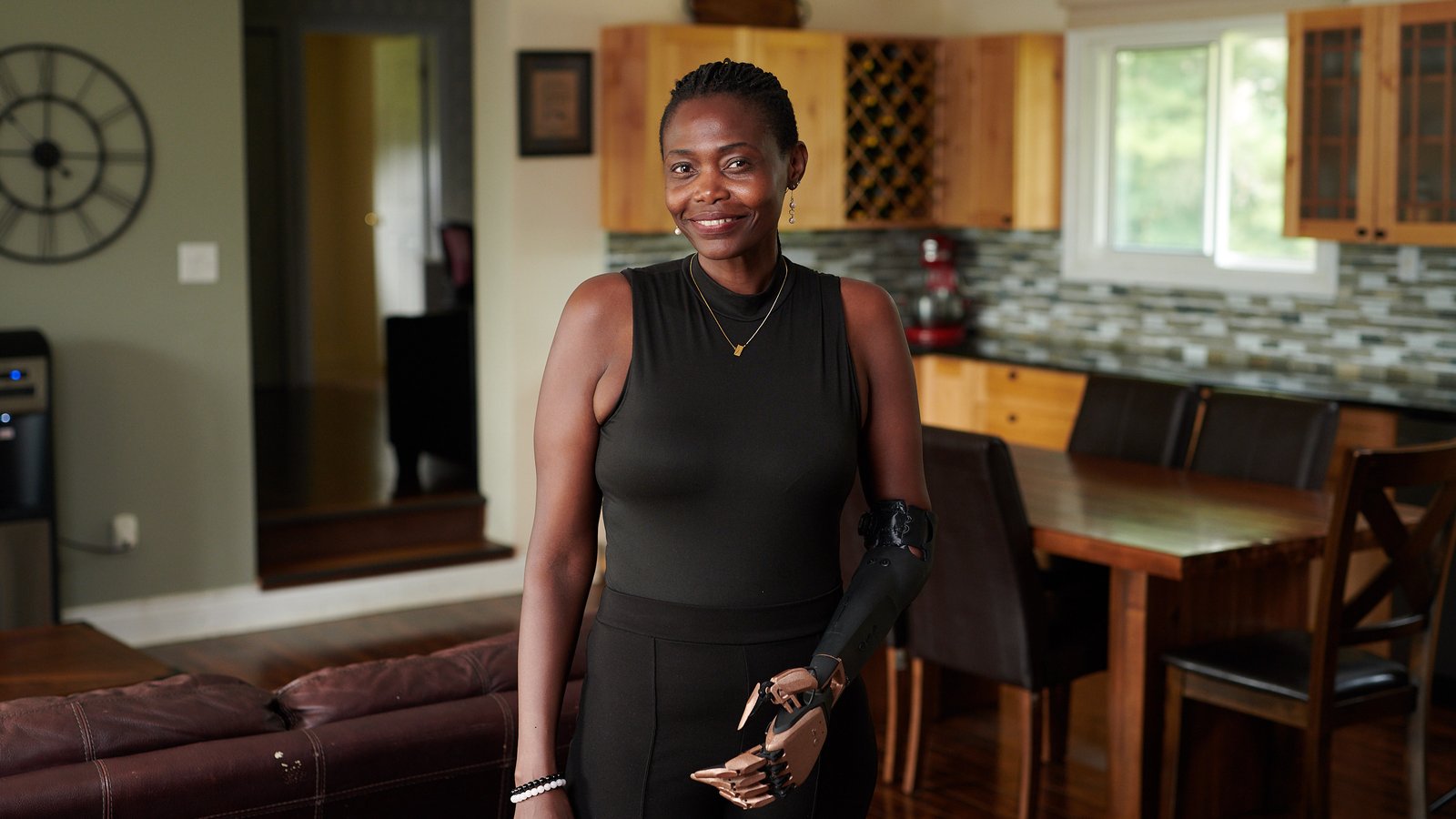Sekai Muscutt wearing her smartARM bionic arm at home